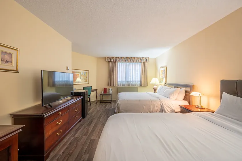 Hotel room with two beds at Domaine Saint-Sauveur - Image 1