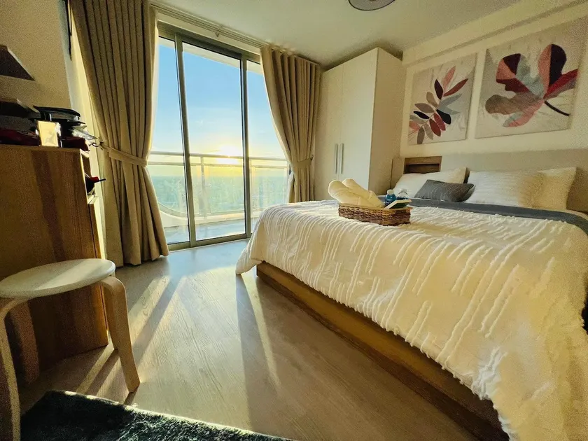1 BEDROOM Serene Bali at Azure North by THE BALI CORNER AT AZURE NORTH, High Floor, Corner Unit, BIG Balcony with Full View of Beach Resort Amenities - Image 1