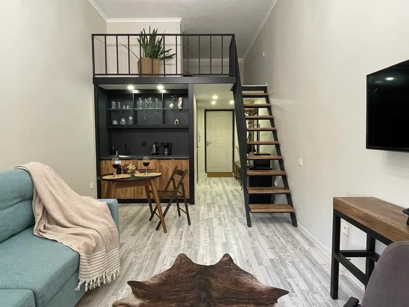 Loft-style studio on two levels in the city center - Image 1