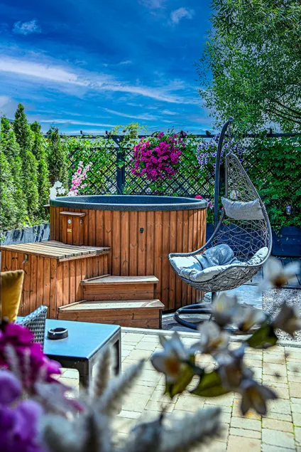 Relax in a cottage with a private hot tub, sauna, and barbecue grill - Image 1