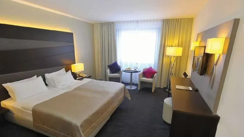 Hotel room with pool and fitness access - Image 1