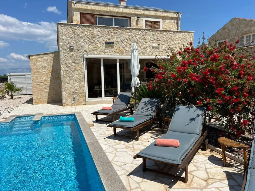 Stone house villa with an electric vehicle charging station - Image 1