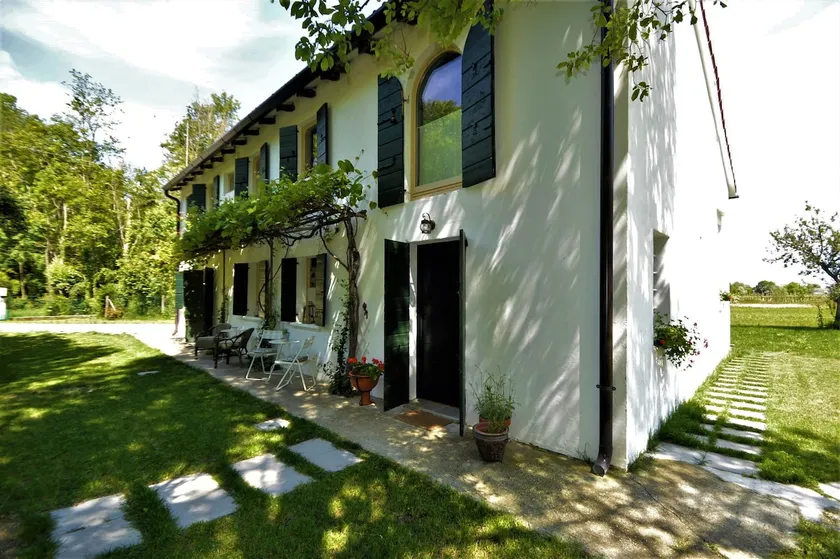 Green Lodge surrounded by the greenery of the countryside - Image 1