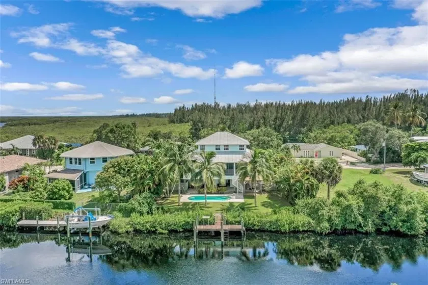 Beautiful waterfront Key West style home with a pool - Image 1