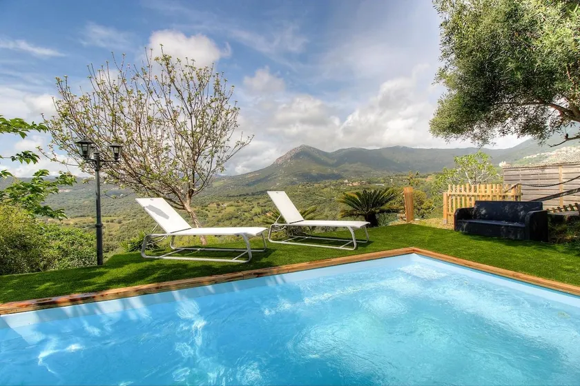 Wooden house between sea and mountain with pool - Image 1