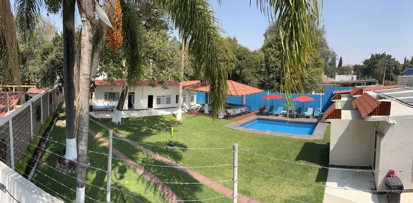 Complete accommodation with garden, swimming pool, and thatch-roof space. - Image 1