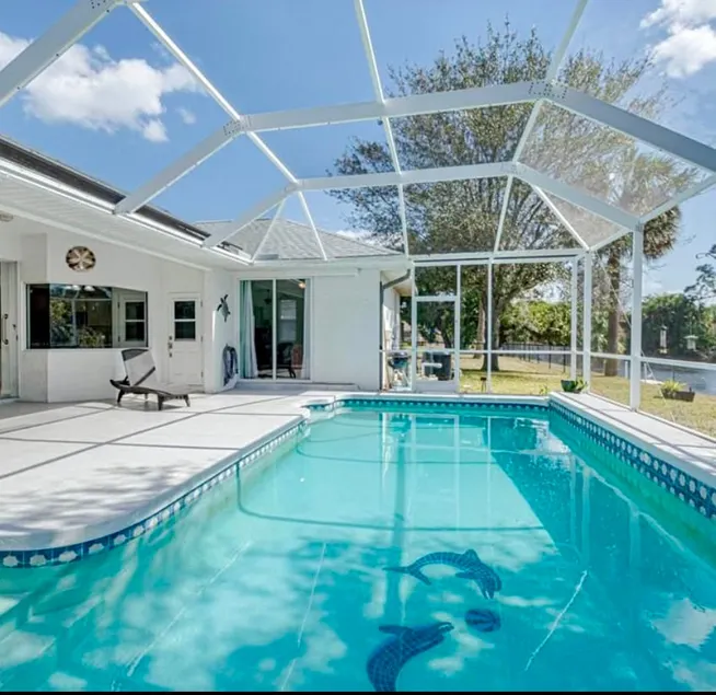 Tropical Canal Retreat with Gorgeous Pool - Image 1