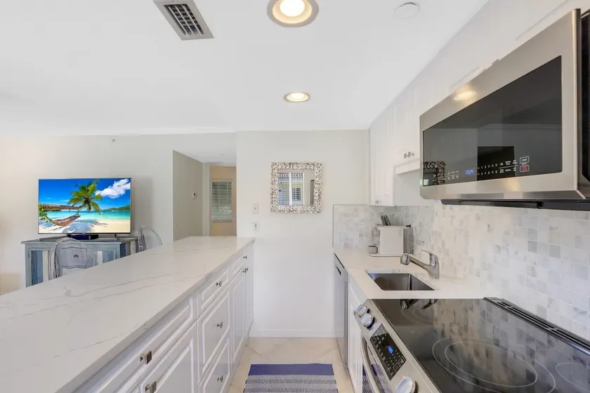 Luxurious condo steps to beach with heated pool! - Image 1