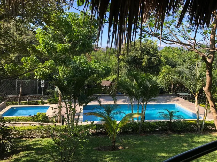 House in a residential complex with a swimming pool and common green areas - Image 1