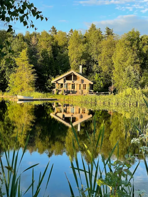 Cabin in a beautiful location by a pond with a view to the west. - Image 1