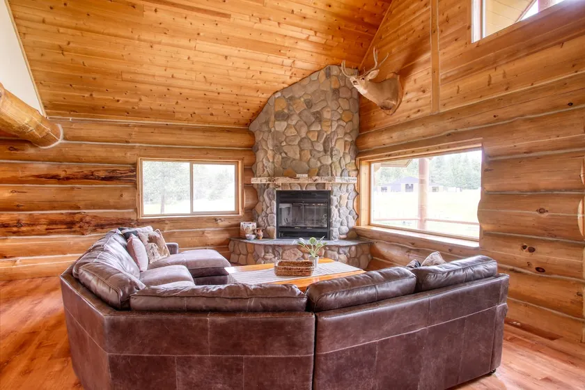 The Cabin · Rustic Log Cabin with Pasture and Mountain Views - Image 1
