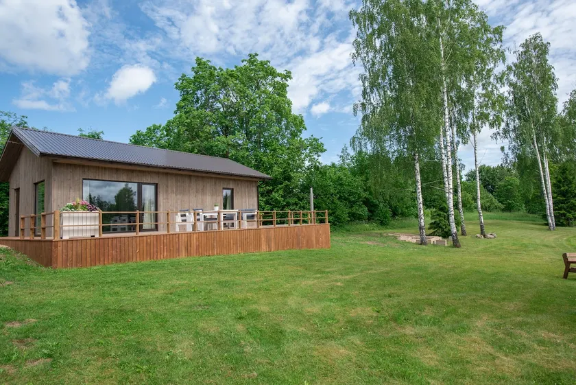 Modern holiday house on the shore of a waterhole with a sauna - Image 1