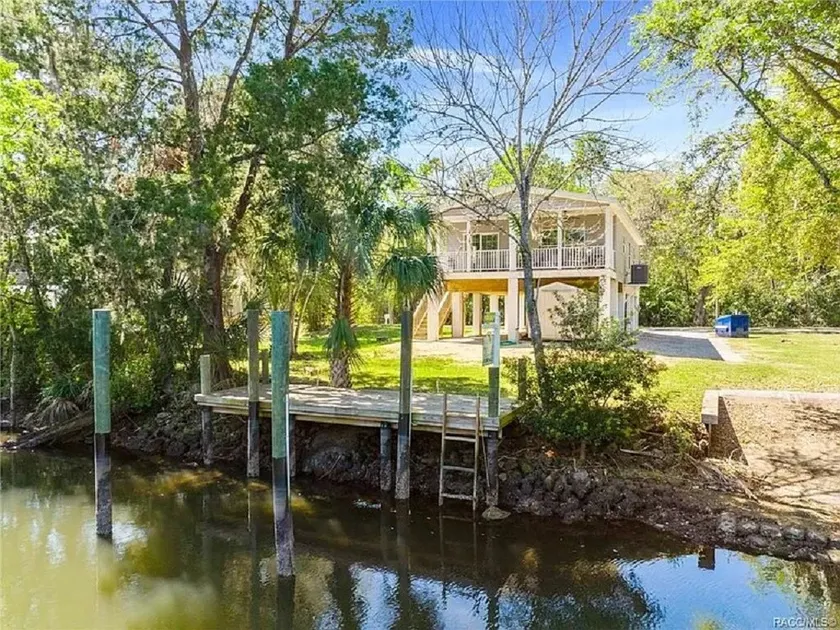 Waterfront home with dock and boat ramp - Image 1