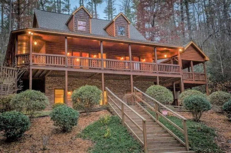 Riverfront cabin with WiFi, 2 fireplaces, game room, pool table and hot tub. - Image 1