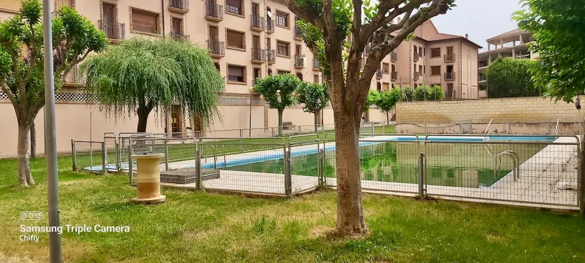 A bright apartment in a residential development with a swimming pool - Image 1