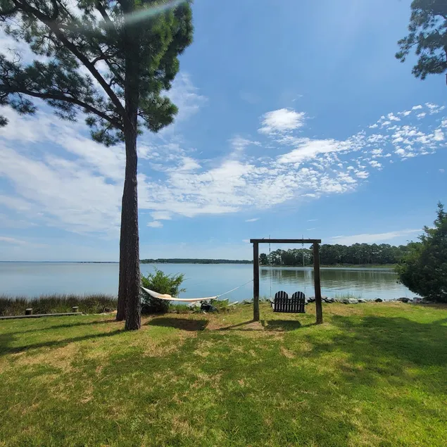 WATERFRONT!! **HOT TUB**  3 bedroom Oasis on 2+ acres - Sleeps 8 - Image 1