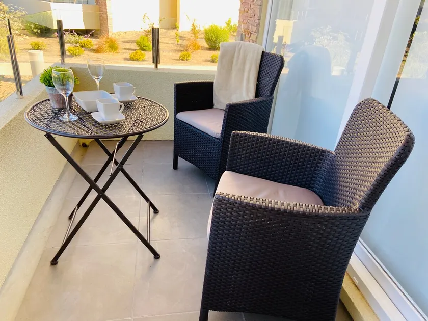 Cozy, in front of the condominium pool. - Image 1