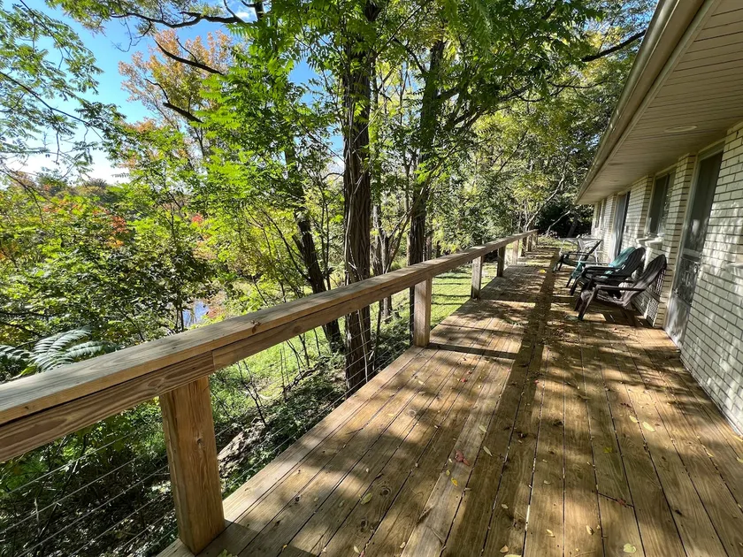 Riverfront mid-century home surrounded by nature! - Image 1