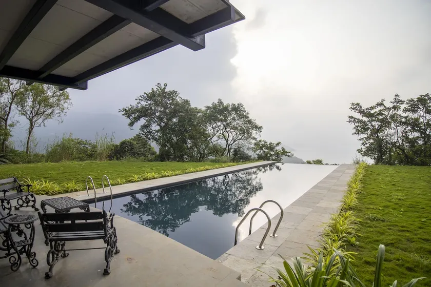 SaffronStays Solasta - 2BR luxury villa with black marble infinity pool, lotus pond & dam views in Mulshi - Image 1
