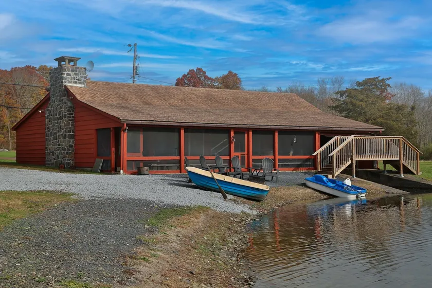 Serene cabin on 6 acre pond in rural Upper Bucks - Image 1