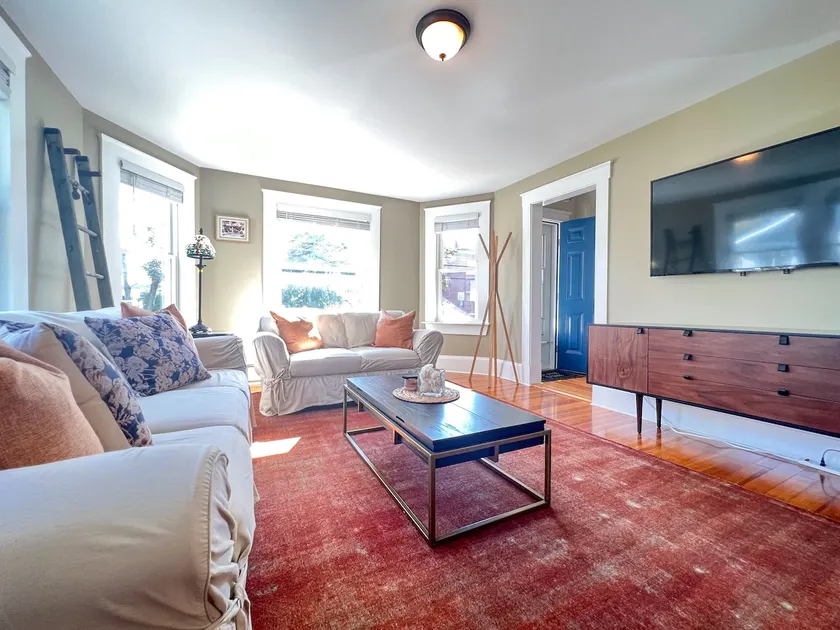 Cozy three-bedroom home close to Boston w/ plenty of parking - Image 1
