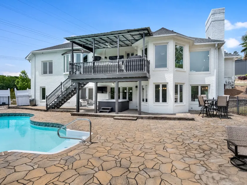 Beautiful Waterfront Home with abundant outdoor seating, pool, hot tub, grill - Image 1