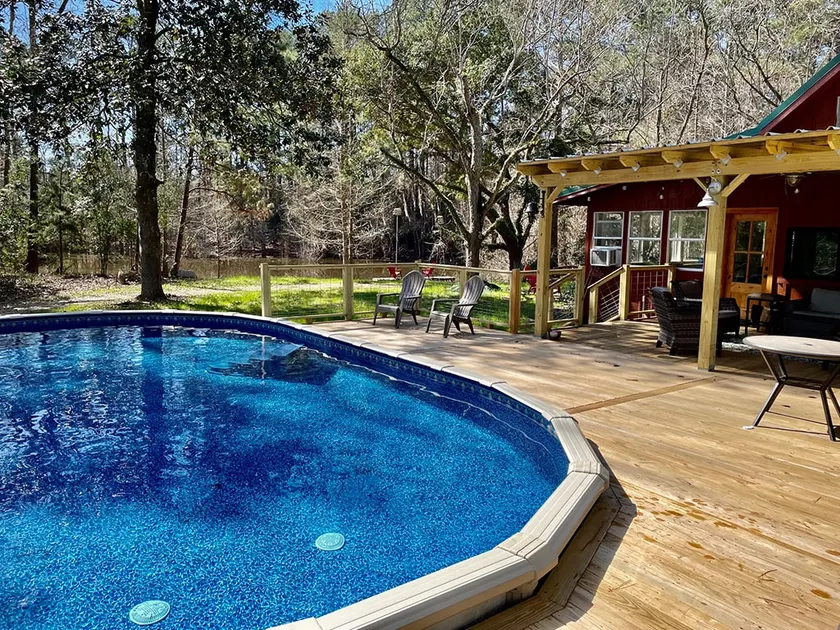 Private Cabin w Pool & Hot Tub on 14 Acres - 1 HR From Houston - Image 1