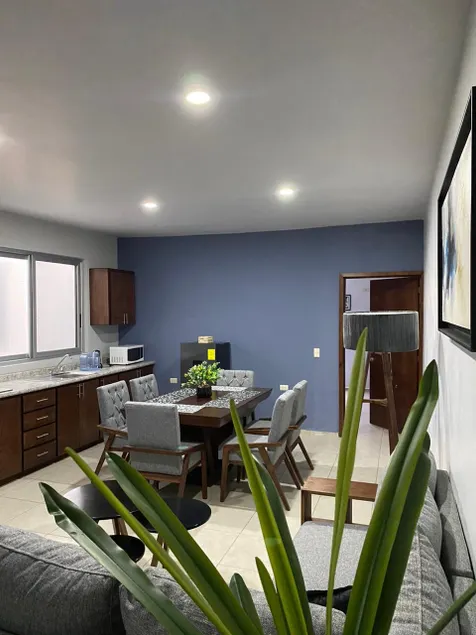 Luxurious Apartment #1 with a living room, dining room, and garage - Image 1