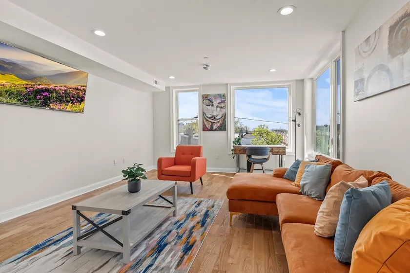 Modern 2BR with Private Rooftop and Skyline Views - Image 1
