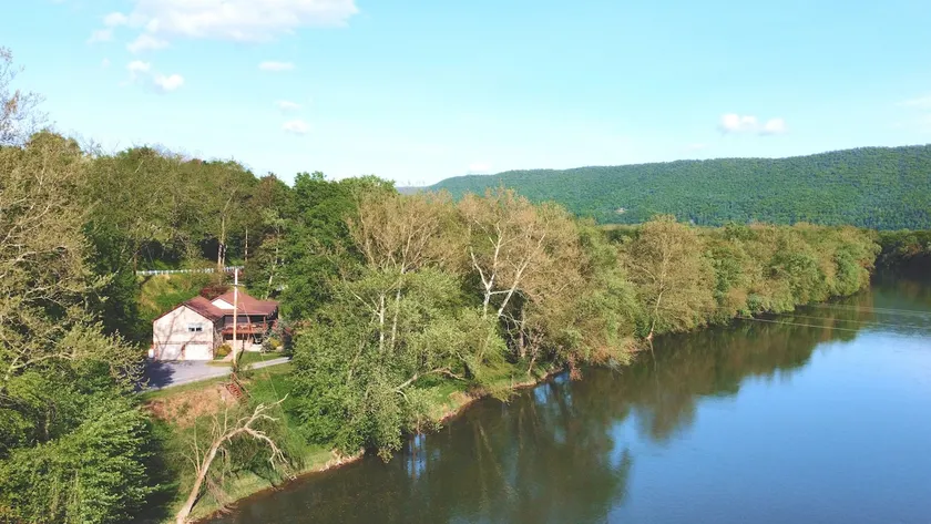 Lazy Bass Lodge | Riverfront + Porch - Image 1