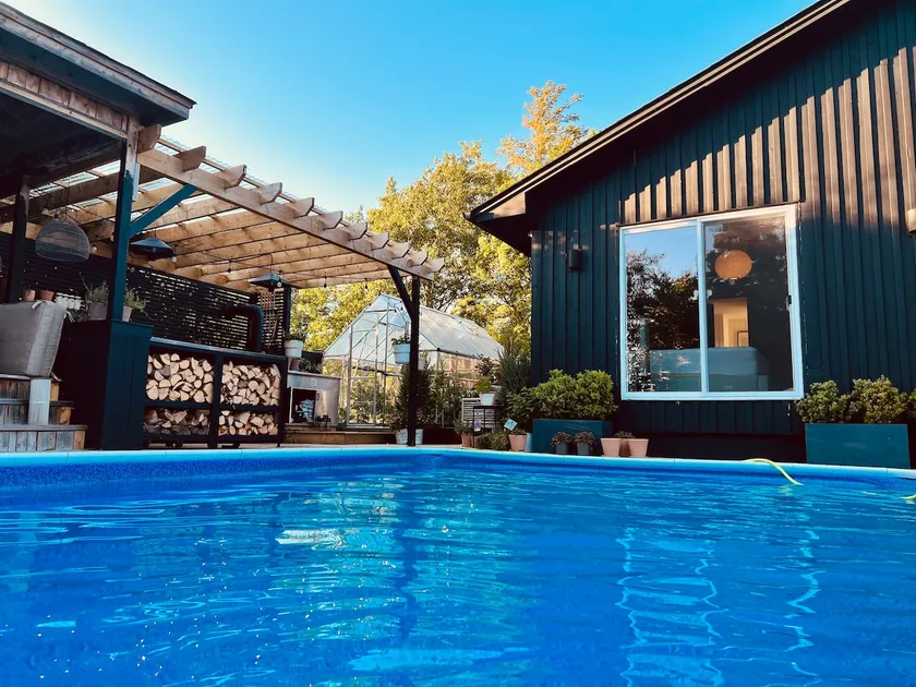 Nordic Style Private Riverfront Cottage with Heated Pool & Hot Tub - Image 1