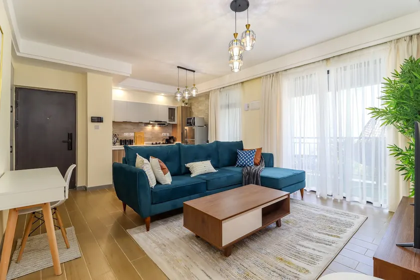 Elegant 2BR Central Haven w/ Pool, Gym & Rooftop - Image 1