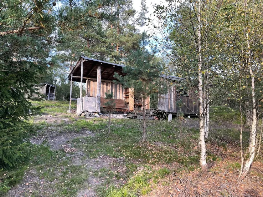Intimate cabin with lean-to. - Image 1