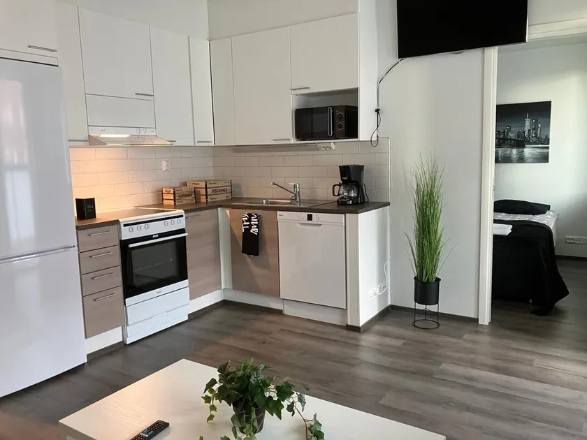 Stylish two-room apartment with sauna, balcony, and a place to park - Image 1