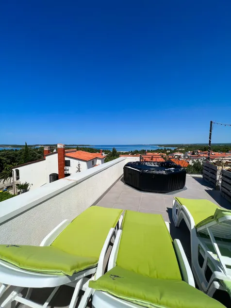Sunset Bliss: Seaview Penthouse + Rooftop Jacuzzi - Image 1