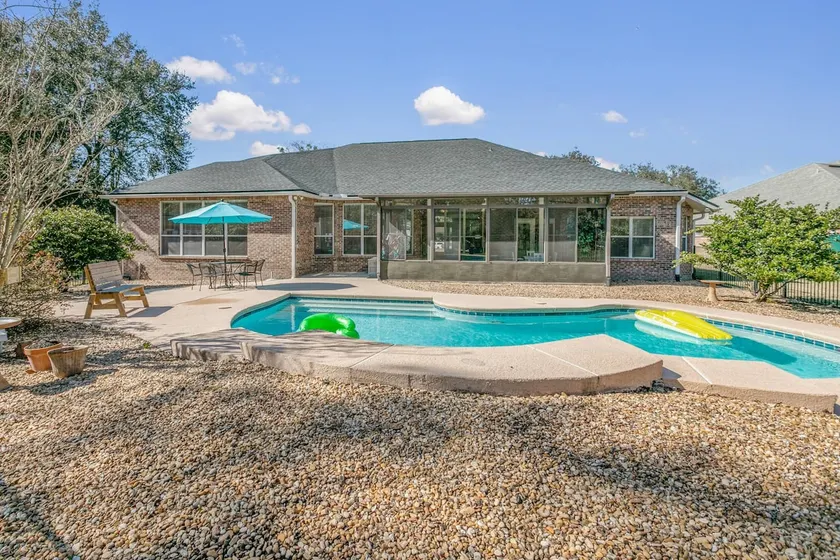 Sunset Pass Pool Home - Screened Patio + Yard - Image 1