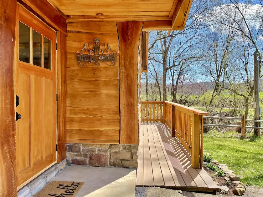 Bluebird Hollow is a cozy little home in the woods - Image 1