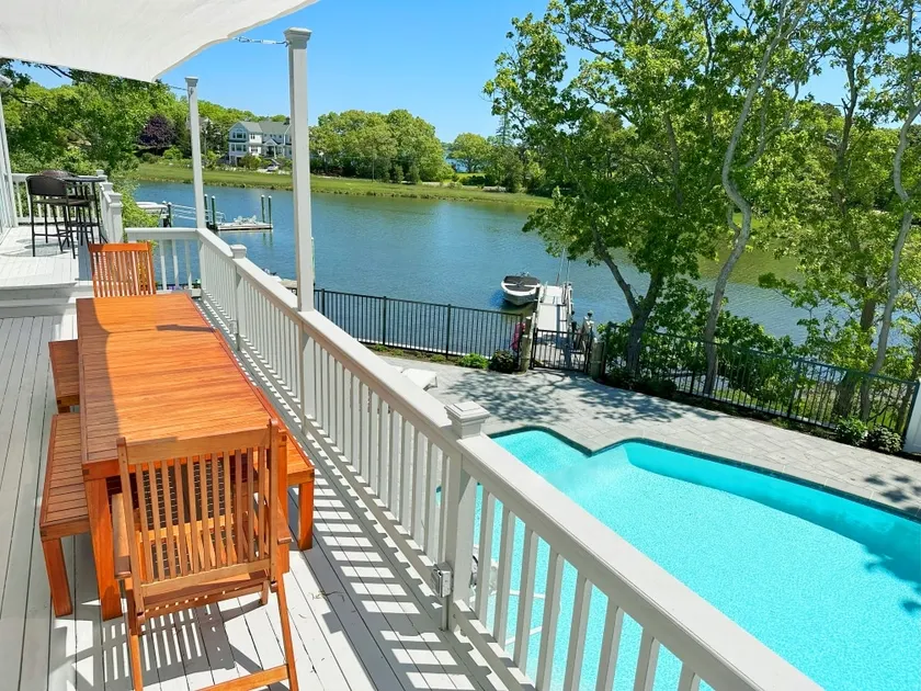 Waterfront home with private boat dock, heated pool, kayaks, A/C, and more - Image 1