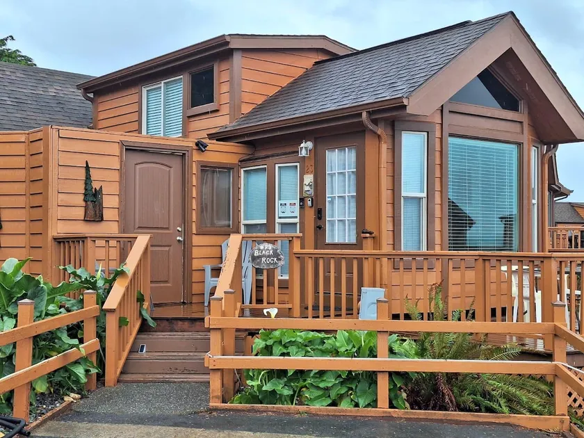 Ocean Cabin 23 is a cozy seaside bungalow with loft, limited ocean views, and private beach. - Image 1