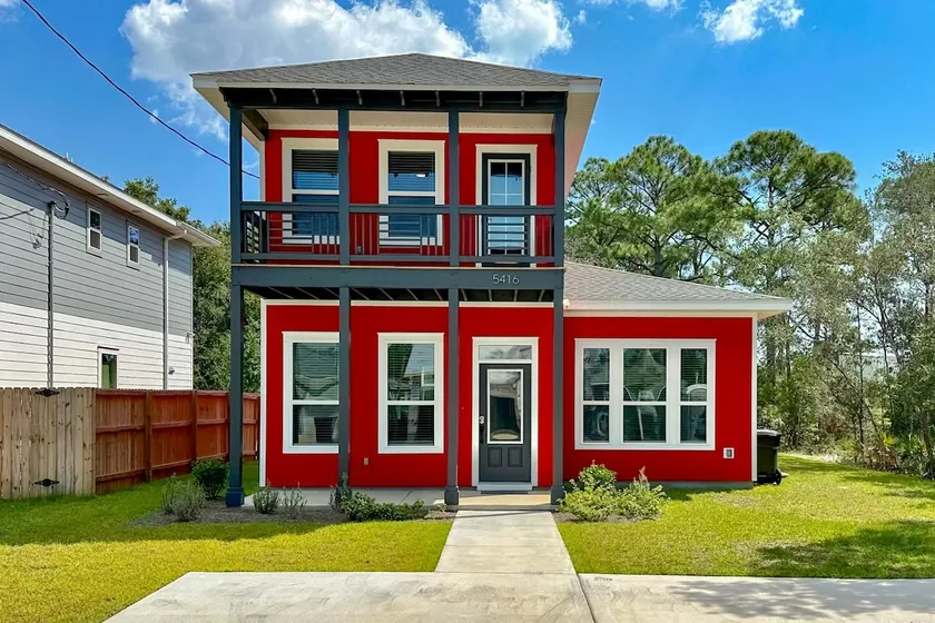 Modern home with large backyard, deck, and close t - Image 1
