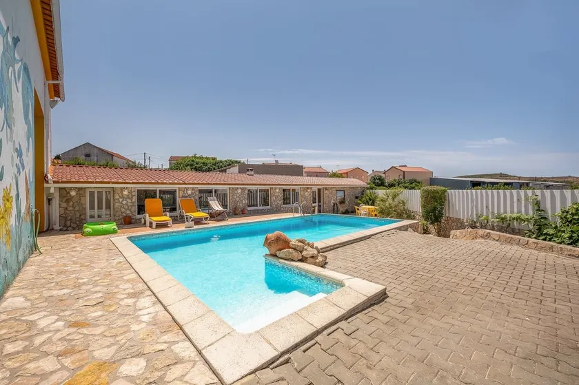 Eclectic oasis with poolside charm in Arranhó - Image 1