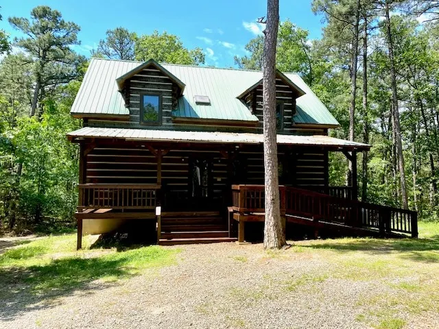 Acorn Acres is a true log cabin nestled in - Image 1