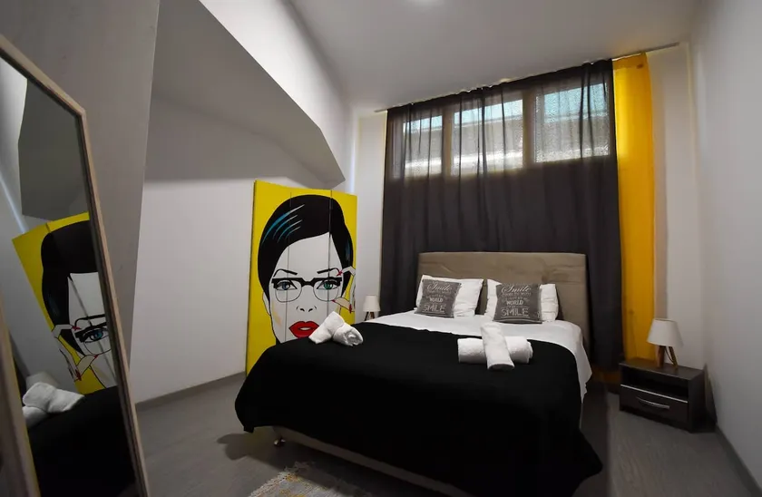Two-Bedroom Apt Semi-Basement Aristotelian Suites - Image 1