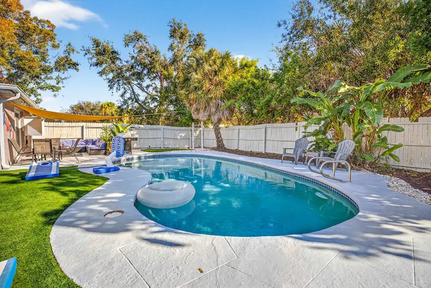 Family Putting Green Oasis BBQ Cornhole Heated Pool - Image 1