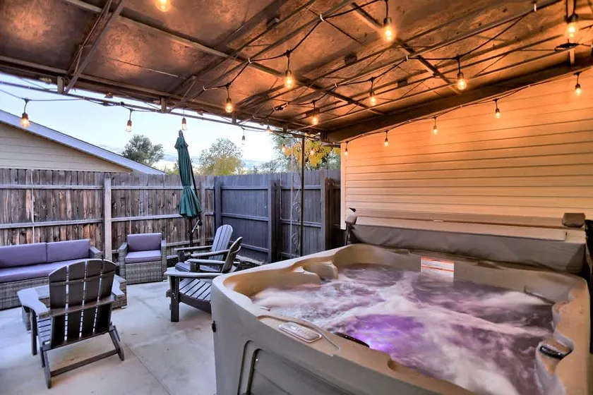 Outdoor Oasis: Unwind in the hot tub under twinkli - Image 1