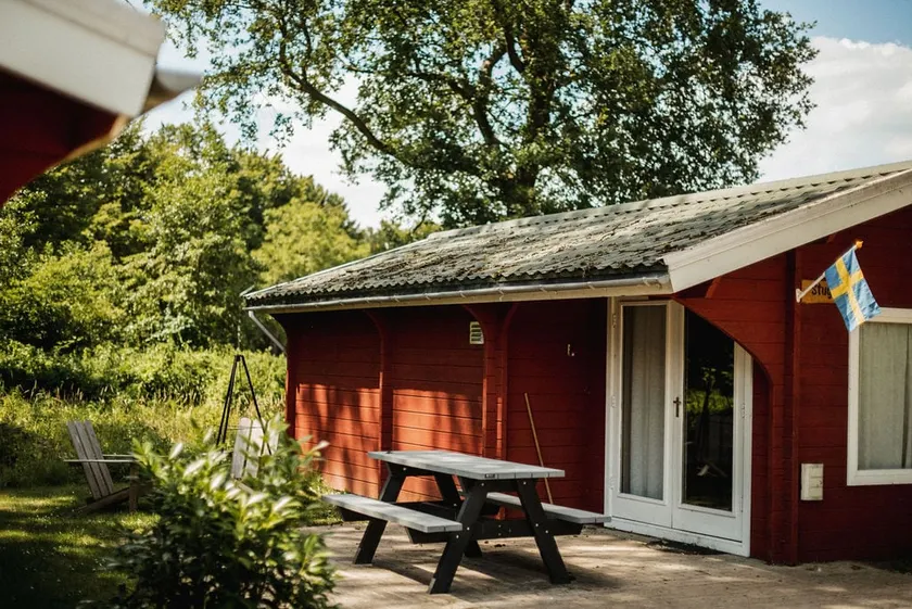 Scandinavian wooden cabin with wood-burning stove - Image 1