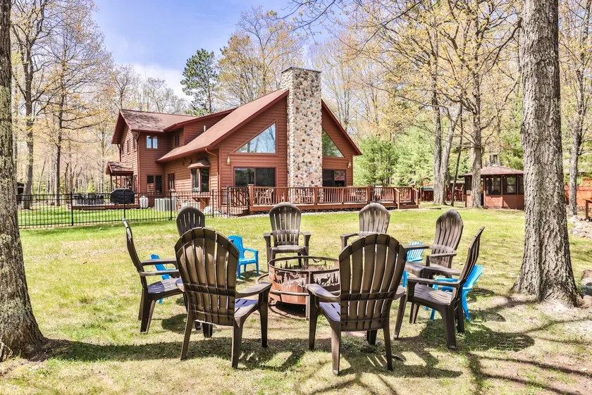 Large lakeside home with hot tub, gazebo, dock, firepit, and fenced in yard! - Image 1