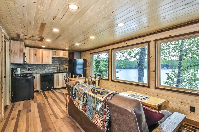 Remodeled lakeside resort cabin with fireplace, sandy beach, dock, firepit! - Image 1