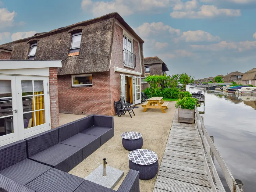 Holiday home with waterside terrace - Image 1