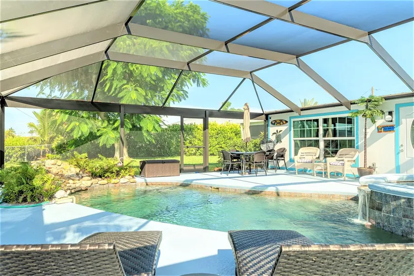 Pine Island Beach House!  *Gulf Access, Heated Pool, Hot Tub & Boat Dock* - Image 1